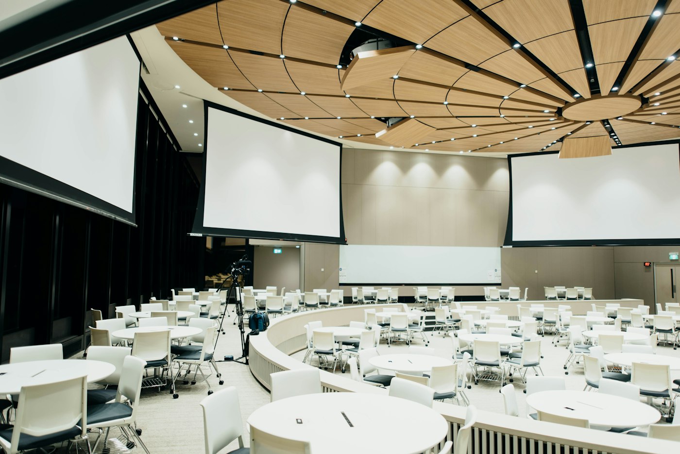 A large hall set with round tables
