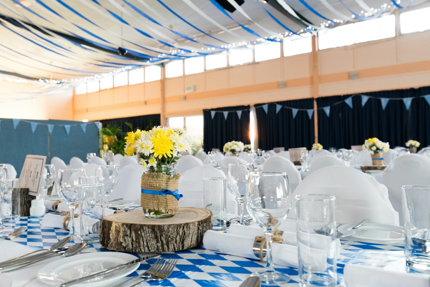Bright hall with long dressed tables