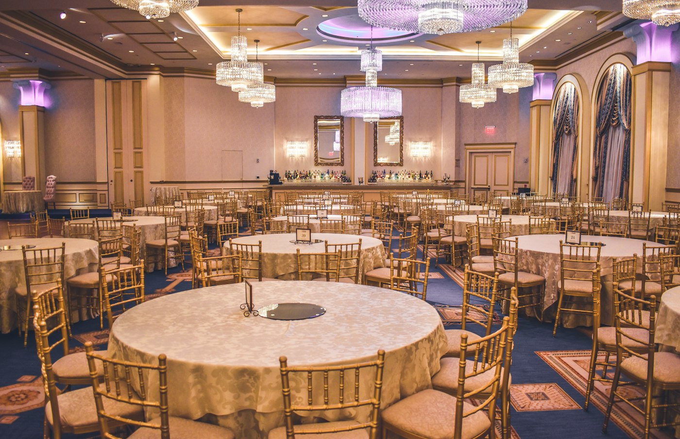 Ballroom with chandeliers and round tables