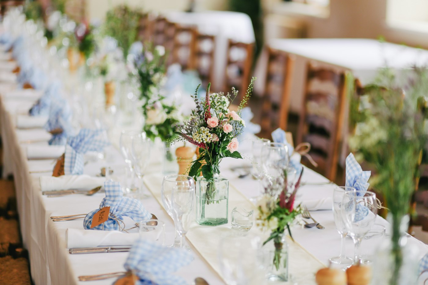 Long banquet table with florals